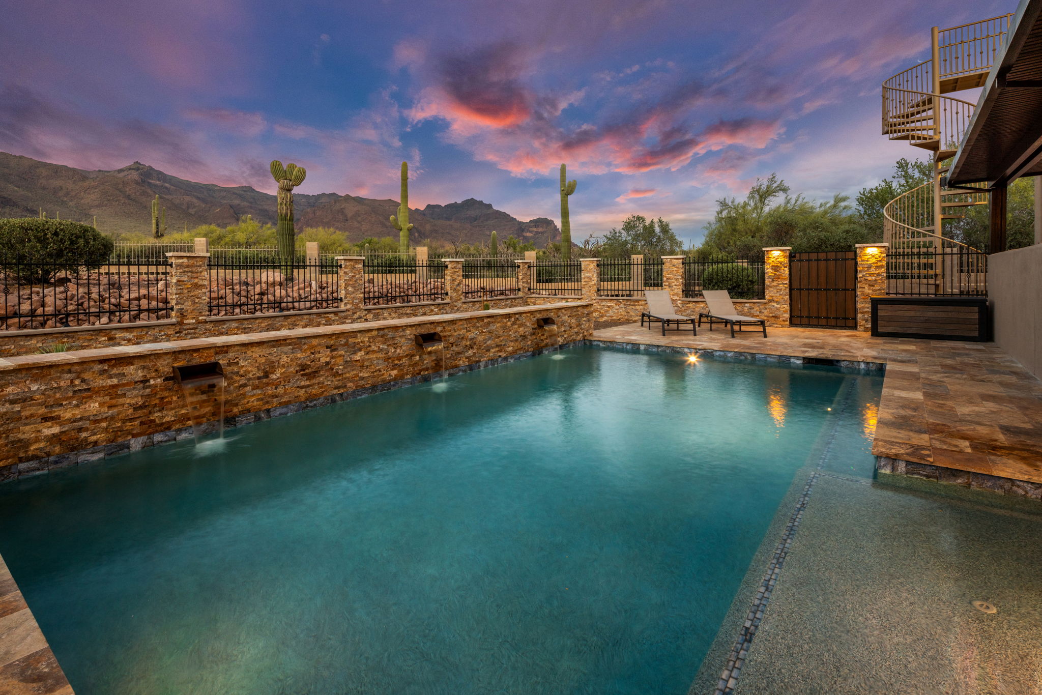Desert sunset pool with mountain views